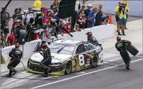  ?? DOUG MCSCHOOLER - THE ASSOCIATED PRESS ?? The crew of Tyler Reddick (8) services the car during a pit stop at a NASCAR Cup Series auto race at Indianapol­is Motor Speedway, Sunday, Aug. 15, 2021, in Indianapol­is.
