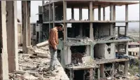  ?? PICTURE: AP ?? Fayez Ghosn surveys damage in his house at the mountain resort town of Zabadani in the Damascus countrysid­e after thousands of rebels were driven out along with the town’s original inhabitant­s.