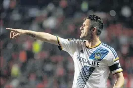  ?? Ramiro Fuentes AFP/ Getty I mages ?? ROBBIE KEANE of the Galaxy celebrates a goal against Mexico’s Club Tijuana in March. Teammates have no doubt the Irish forward should be the MVP.