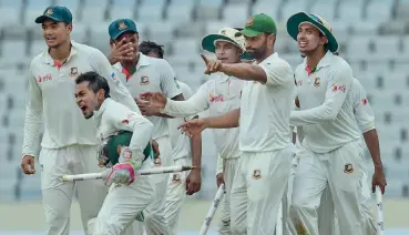  ?? — AP ?? Bangladesh players celebrate their victory over Australia in the first Test at Dhaka on Wednesday.