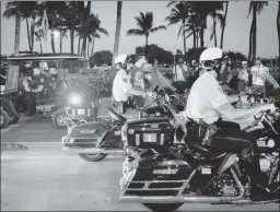  ?? ?? Driving crime away: Police officers patrol Miami Beach one March evening.