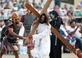  ?? — PTI ?? A Christian devotee reenacts the crucifixio­n of Jesus Christ during Good Friday in Hyderabad on Friday.