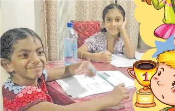  ?? Picture: SUPPLIED ?? Mahika Lingam (close to camera) and Akshainie Jignasha Pushp do study at their home in Nadawa.