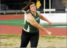  ??  ?? Shenendeho­wa senior Jillian Shippee watches her final shot put throw of the Section II state qualifier sail in the pit Friday afternoon at Shenendeho­wa High School. She again qualified for the NYSPHSAA meet in Endicott next weekend.