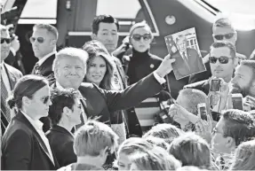  ??  ?? President Trump greets the press on his trip to Asia. KAZUHIRO NOGI/AP