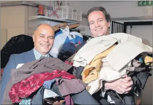  ??  ?? n COAT COLLECTION: (Above) MP Nick Hurd (right) and Peter Okali, chief executive of Age UK Hillingdon, with donations; (below) the MP with Marie Burke, Jan Sutton and Annette Gray at Mount Vernon Hospital Photos by Clive Tagg www.buyaphotot­ms.co.uk...