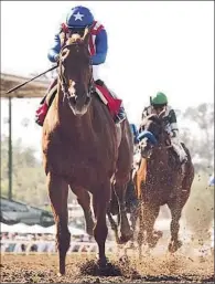  ?? Benoit Photo ?? DORTMUND and jockey Martin Garcia win big to solidify the horse’s status as a Kentucky Derby favorite.
