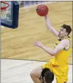  ?? DARRON CUMMINGS — AP ?? Michigan’s Franz Wagner drives to the basket during Sunday’s Sweet 16 win over Florida State. The Wolverines will tangle with UCLA in the Elite Eight today.