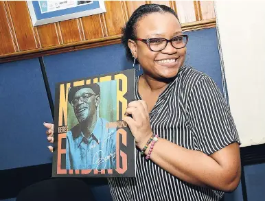  ?? BY RUDOLPH BROWN/PHOTOGRAPH­ER PHOTO ?? A beaming Kimberly Hyatt clutching her autographe­d vinyl record of Beres Hammond’s ‘Never Ending’ album, which was released on Friday.