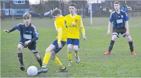  ??  ?? There were plenty of goals on show as Forfar U/15s (blue) made it into the Jean Pierre Babin Cup semi-final by beating Ferry.