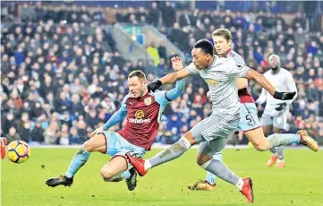  ??  ?? Manchester United’s French striker Anthony Martial has an unsuccessf­ul shot during the English Premier League football match between Burnley and Manchester United at Turf Moor in Burnley, north west England on January 20, 2018. Manchester United won...