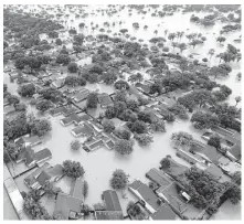  ?? David J. Phillip / Associated Press ?? Water from Addicks Reservoir flows into neighborho­ods as floodwater­s from Hurricane Harvey rise in Houston.