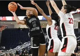  ?? ANJALI SHARIF-PAUL — STAFF PHOTOGRAPH­ER ?? Sierra Canyon's Jerzy Robinson takes a shot as Etiwanda defends during Friday's CIF Southern Section Open Division girls basketball championsh­ip game at Cal Baptist.