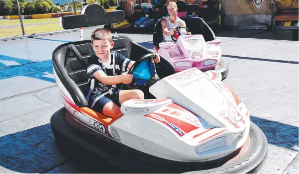  ?? Picture: STEWART McLEAN ?? TEST DRIVE: Jack Prowse, 7, and his mum Marika Andersson from Whitfield on the dodgem cars at the Cairns Showground.