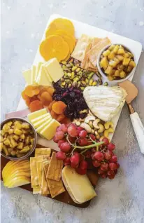  ?? ?? Top: Stuffed Delicata squash (center); red salad with apples (clockwise from top right); apple crumble; Brussels sprouts; fruit and cheese platter with pear chutney, also seen above.