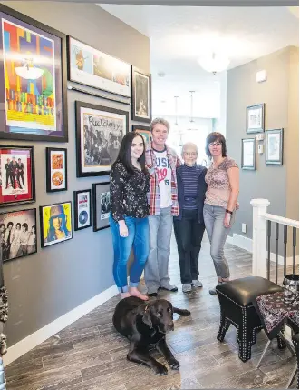  ?? MICHELLE HOFER ?? Darren and Sharon Anderson. with their daughter Darci, Darren’s mom Shirley Ferrier, and their dog Ace in their rock ’n’ roll infused home by Sterling Homes in Nolan Hill.