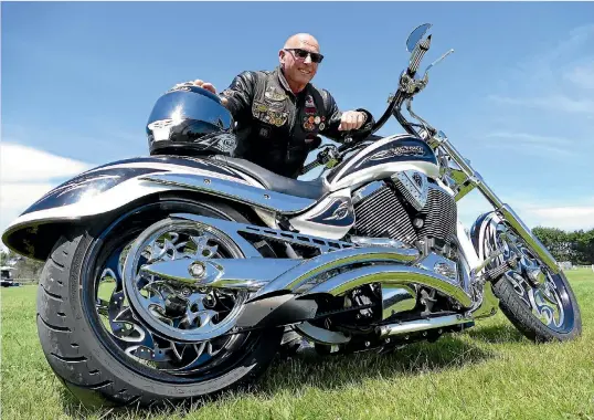  ?? JOHN HAWKINS/FAIRFAX NZ ?? Motorcycle enthusiast Geoffrey Milne poses with one of his two motorbikes, his Victory Jackpot number 99 of 100 Cory Wess, ahead of the annual Burt Munro Challenge in Invercargi­ll.