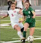  ?? Lori Van Buren / Times Union ?? Mechanicvi­lle’s Nevaeh D’aloia, left, battles with Gianna Viscusi, who scored the go-ahead goal and two more as Schalmont rallied.
