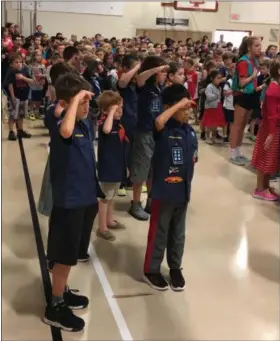  ??  ?? Bradford Heights Elementary School students participat­ed in the Patriots Day ceremony at their West Bradford Township school on Tuesday to honor those who died in the terrorist attacks 17 years ago.