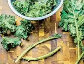  ??  ?? While the soup is simmering, de-stem the kale, then hand tear into manageable pieces, then wash well.