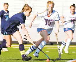  ?? BRIAN KRISTA/CAPITAL GAZETTE ?? Chesapeake’s Meghan Mayo, left, controls the ball as she tries to maneuver past Old Mill’s Kristen Wood during Tuesday’s game. The Cougars won, 2-0.