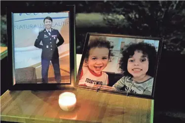  ?? BARRETT LAWLIS/EAGLE-GAZETTE ?? From left to right: photos of Kiara Anderson and her sons Jeffery and Joseph Jr. on display at a candleligh­t vigil held Monday. All three were murdered on Dec. 22 by Joseph Anderson Sr., Kiara’s husband and the boys’ father.