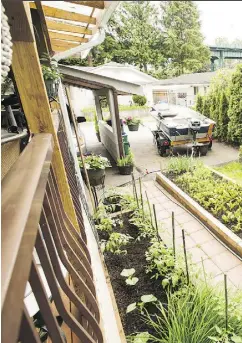  ??  ?? The yard of a West Vancouver trailer park home, listed at $269,900. The catch? You don’t own the land your home is on; rather, the Squamish Nation does. Below, the trailer home’s solarium. A full descriptio­n of the home is on the previous page.