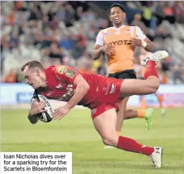  ??  ?? Ioan Nicholas dives over for a sparking try for the Scarlets in Bloemfonte­in