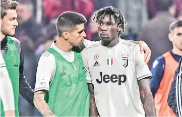  ?? Photograph: - Marco Bertorello/AFP/ Getty Images ?? Moise Kean was subjected to monkey chants from Cagliari supporters during the 2-0 win ofr Juvengus.