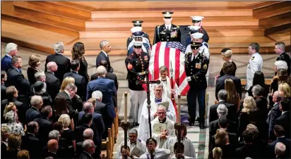  ?? Washington Post photo by Jonathan Newton ?? Presidents Bill Clinton, George Bush and Barack Obama look on with the family as Sen. John McCain’s casket is taken out following the funeral service at the National Cathedral. McCain was a six-term senator from Arizona and former Republican nominee for president, who died Aug. 25 from brain cancer. He was 81.