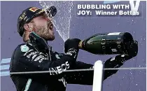  ??  ?? BUBBLING WITH JOY: Winner Bottas