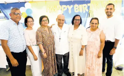  ?? PHOTOS BY RUDOLPH BROWN/PHOTOGRAPH­ER ?? Monsignor Gregory Ramkissoon (centre) with his brother, sisters and nephew, from left: Anand Ramkissoon, Shareeza Ramkissoon, Karen Mohammed, Roma Adam, Carol Sammy and Siddel Ramkissoon at his 70th birthday anniversar­y Mass of Thanksgivi­ng at Sacred Hearts of Jesus and Mary Chapel, Jacob’s Ladder in Moneague, St Ann, on May 4.