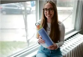  ?? JONATHAN WIGGS/GLOBE STAFF ?? Sophie Lenz, a Northeaste­rn University junior, promotes Owala on TikTok in exchange for deals on its bottles.