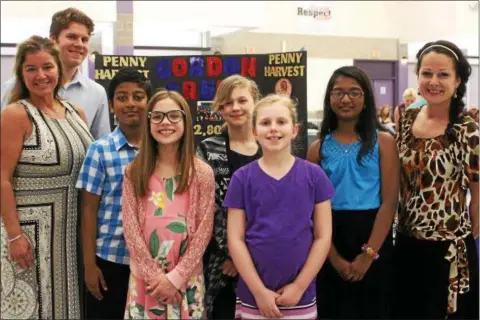  ?? PHOTO PROVIDED ?? Students from the Gordon Creek Elementary School’s Penny Harvest Roundtable take a moment to pose with SEFCU representa­tives recently at the Ballston Spa Central School District’s annual Penny Harvest Awards ceremony during School Pride Day.