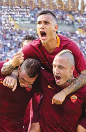  ??  ?? Roma’s Edin Dzeko, left, celebrates with teammates Leandro Paredes, centre, and Radja Nainggolan after scoring against Napoli Photo: AP