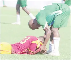  ?? ?? In a touching display of sportsmans­hip, Green Mamba striker Sabelo ‘Sikhali’ Ndzinisa was seen consoling Young Buffaloes defender Sibonelo Sibandze, who was visibly emotional after his team’s loss.