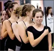  ?? Arkansas Democrat-Gazette/JOHN SYKES JR. ?? Bella Kanaday can’t resist a smile as she and other community cast members practice for this weekend’s performanc­e of The Nutcracker.