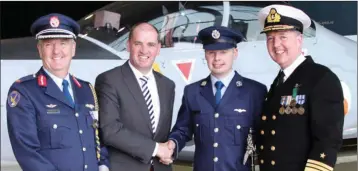  ??  ?? Tadhg Firman of Foulksmill­s being congratula­ted by Minister of State with Responsibi­lity for Defence Paul Kehoe with General Officer Commanding of the Air Corps Brigadier General Paul Fry and Chief of Staff of the Defence Forces Vice Admiral Mark...