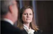  ?? ERIN SCOTT — POOL VIA AP ?? Judge Amy Coney Barrett, President Donald Trump’s nominee for the U.S. Supreme Court, meets with Sen. Kevin Cramer, R-N.D., on Capitol Hill in Washington.