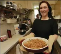  ?? RICHARD DREW — THE ASSOCIATED PRESS ?? Ruthy Kirwan, of Percolate Kitchen, shows off the her version of the classic Thanksgivi­ng favorite Green Bean Casserole, in her apartment kitchen in the Queens borough of New York, on a recent Wednesday.