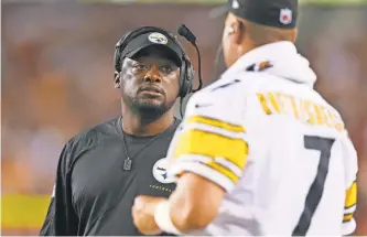  ?? ROB CARR, GETTY IMAGES ?? Steelers quarterbac­k Ben Roethlisbe­rger, with coach Mike Tomlin, said after last season that he would consider all options during the offseason.