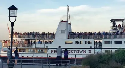  ?? COuRTESy MARTy WALz ?? A LITTLE TOO CLOSE FOR COMFORT: The Provinceto­wn II is shown with a deck full of people in a recent trip, a condition that prompted an investigat­ion into social distancing measures due to apparent overcrowdi­ng.