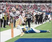  ?? KYUSUNG GONG — THE ASSOCIATED PRESS ?? 49ers wide receiver Deebo Samuel scores a touchdown past Los Angeles Rams cornerback Darious Williams in Inglewood on Jan. 9.