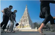  ?? PATIPAT JANTHONG ?? Chinese tourists visit Wiang Gum Gam, a popular destinatio­n in Chiang Mai after appearing in the movie ‘Lost in Thailand’.