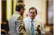  ?? TAMIR KALIFA / AMERICAN-STATESMAN ?? State Rep. John Zerwas, R-Richmond, speaks with a fellow representa­tive on the floor of the House of Representa­tives on Sunday.