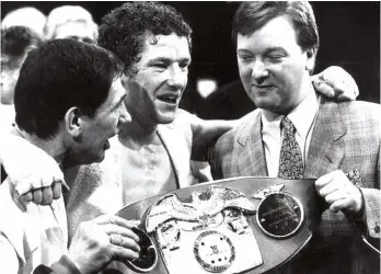  ??  ?? BEFORE THE FALLOUT: Marsh celebrates winning the world title with Warren [above, far right] before their relationsh­ip turned sour due to complicati­ons with the fighter’s retirement when aged just 29