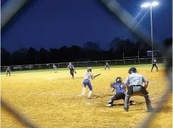  ?? Staff photo by Neil Abeles ?? ■ On the mound last week pitching her team to victory over James Bowie High School is Corinne Ray.