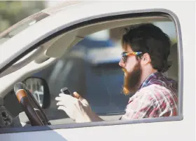  ?? LM Otero / Associated Press 2013 ?? Drivers distracted by calls or texts on their smartphone­s are a menace to others on the road, says the founder of Mothers Against Drunk Driving, who is now campaignin­g against distracted drivers.