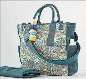  ?? POTTERY BARN KIDS VIA AP ?? Designer Justina Blakeney’s Tigress diaper bag at Pottery Barn Kids pairs one of Blakeney’s signature boho prints with thoughtful features like a magnetic closure, dog clip, and both handles and shoulder strap for carrying options.