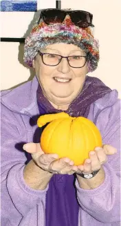  ??  ?? Chris Harris displays the massive orange she grew at her Drouin West property.